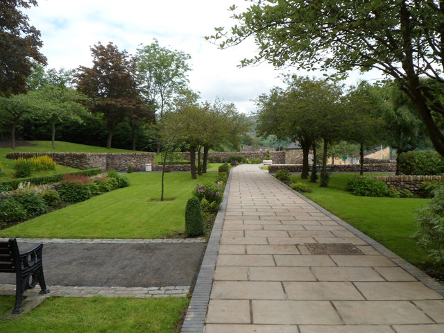 The Memorial Garden, opened in 1970 on the footprint of Pantglas Junior School, with low walls marking out where the classrooms once stood.