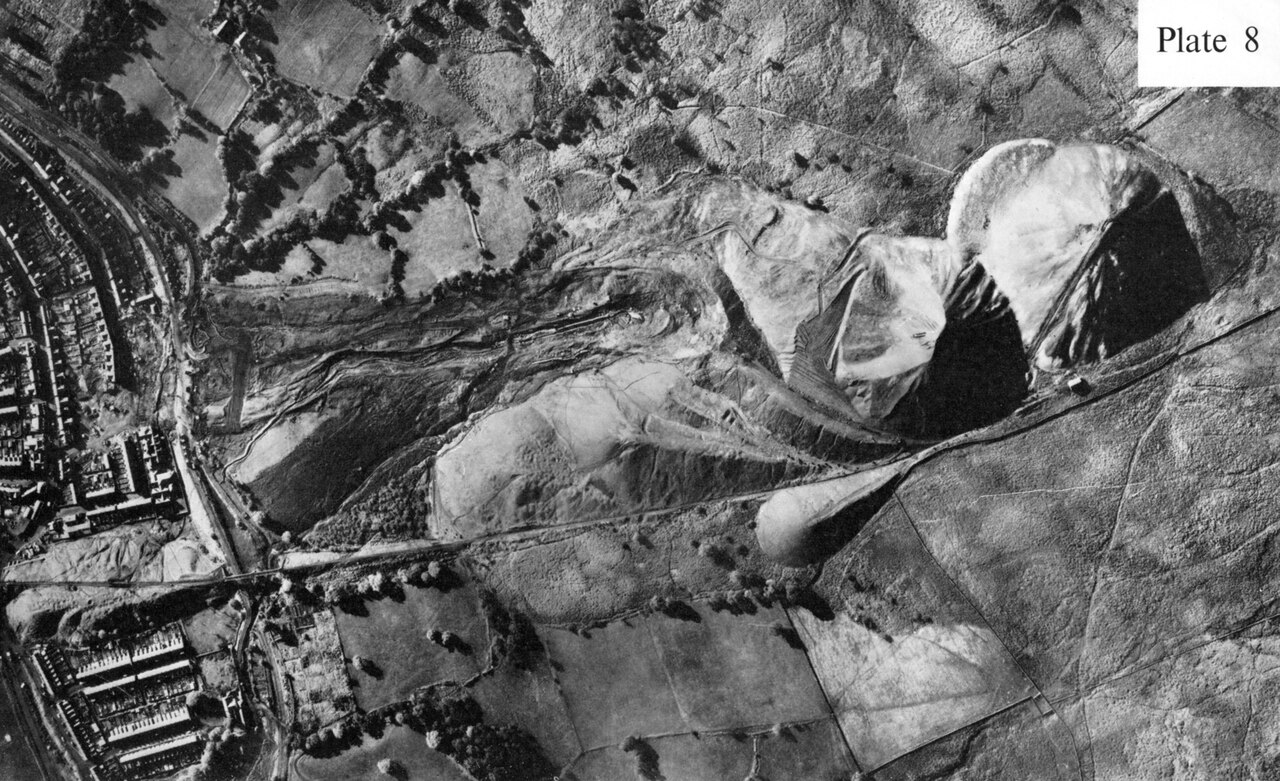 Aerial photograph taken shortly after the disaster, showing the scar left by the collapsed tip running down the hillside into the village.
