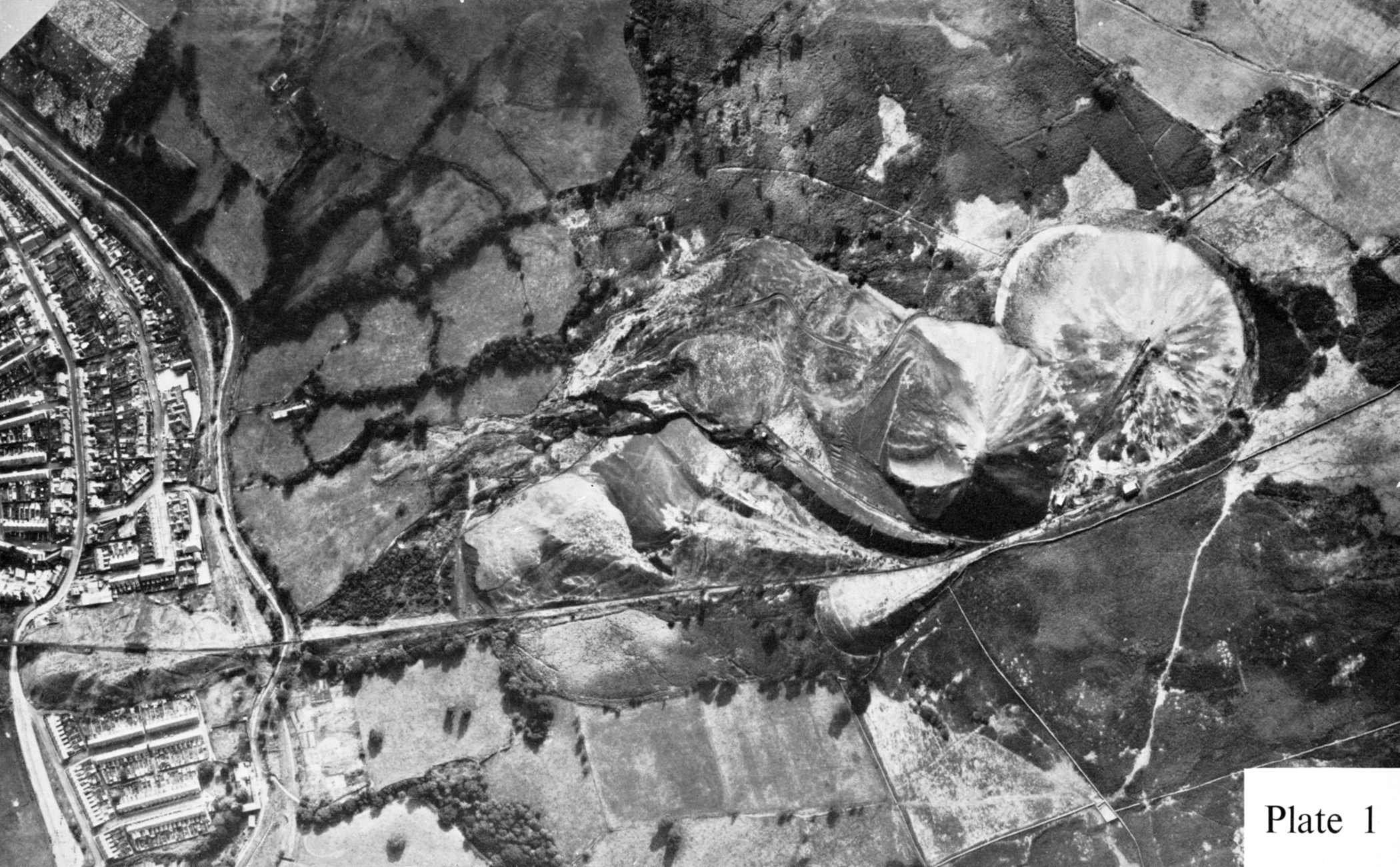 Aerial photograph of the Merthyr Vale Colliery spoil tips above Aberfan, showing the scale of the waste heaps looming over the village before Tip 7 collapsed.