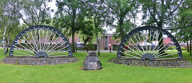 Preserved colliery winding wheels in the centre of Clay Cross, erected in memory of Derbyshire miners killed in local collieries.