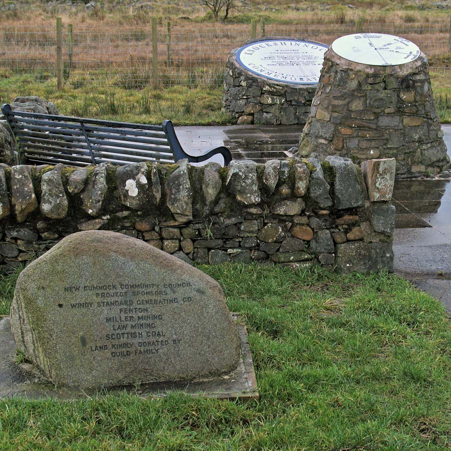 The shovel-shaped memorial to the Knockshinnoch Castle Colliery disaster, New Cumnock, with 13 red slabs marking the dead and 116 grey slabs marking those rescued.
