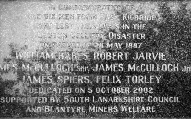 A granite plaque commemorating the six East Kilbride men who lost their lives in the Udston Colliery disaster on 28 May 1887, with their names