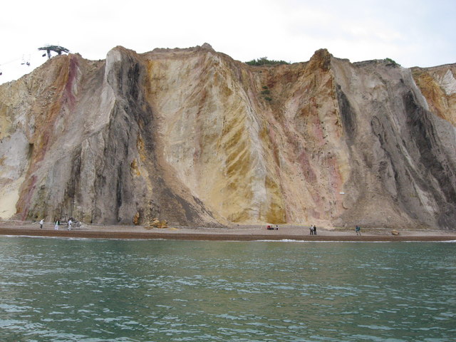 The near-vertical bands of coloured sand in the cliffs at Alum Bay.