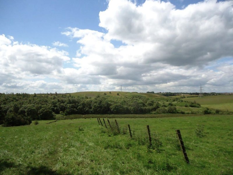A landscaped hillside at Annathill marking the site of the former Bedlay Colliery, its shape the result of open-cast coal recovery and later land restoration rather than any surviving structure.