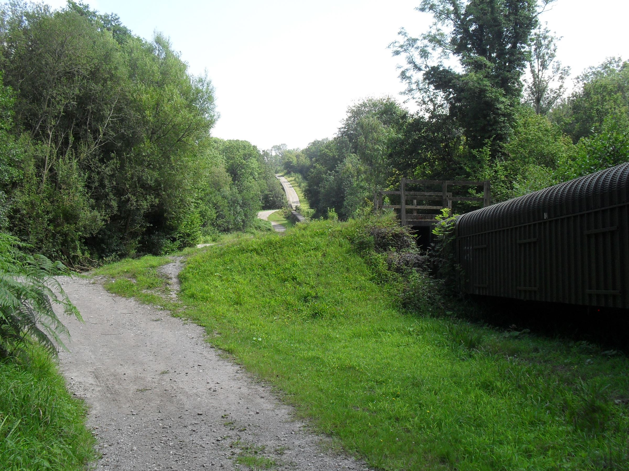 The mine buildings seen across fields between Brightling and Mountfield in summer.