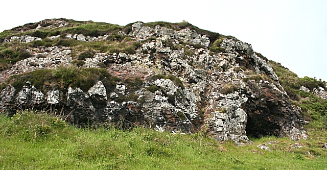 Cave-like hollow in a rock outcrop on Rathlin Island, the Neolithic porcellanite axe factory at Brockley