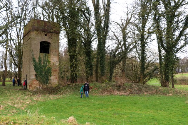 A roofless stone building on Caprington golf course built to look like a small Scottish tower house, with crow-stepped gables and a corner turret, once the colliery’s Newcomen engine house