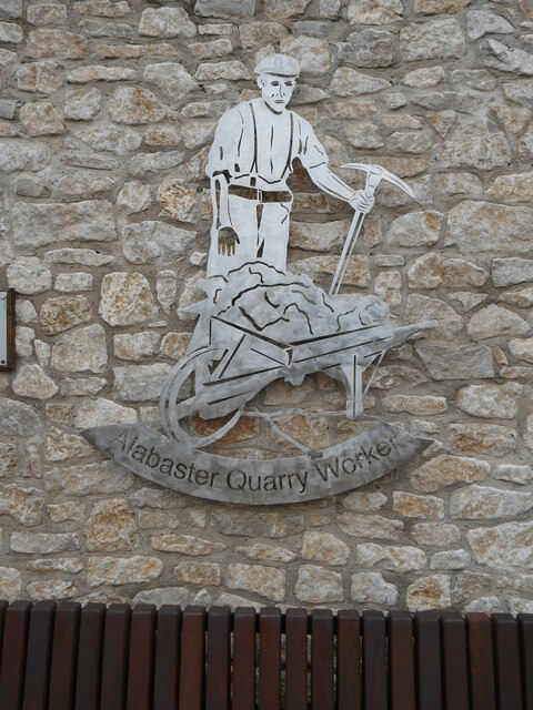 A commemorative depiction of an alabaster quarry worker, Chellaston, Derby.
