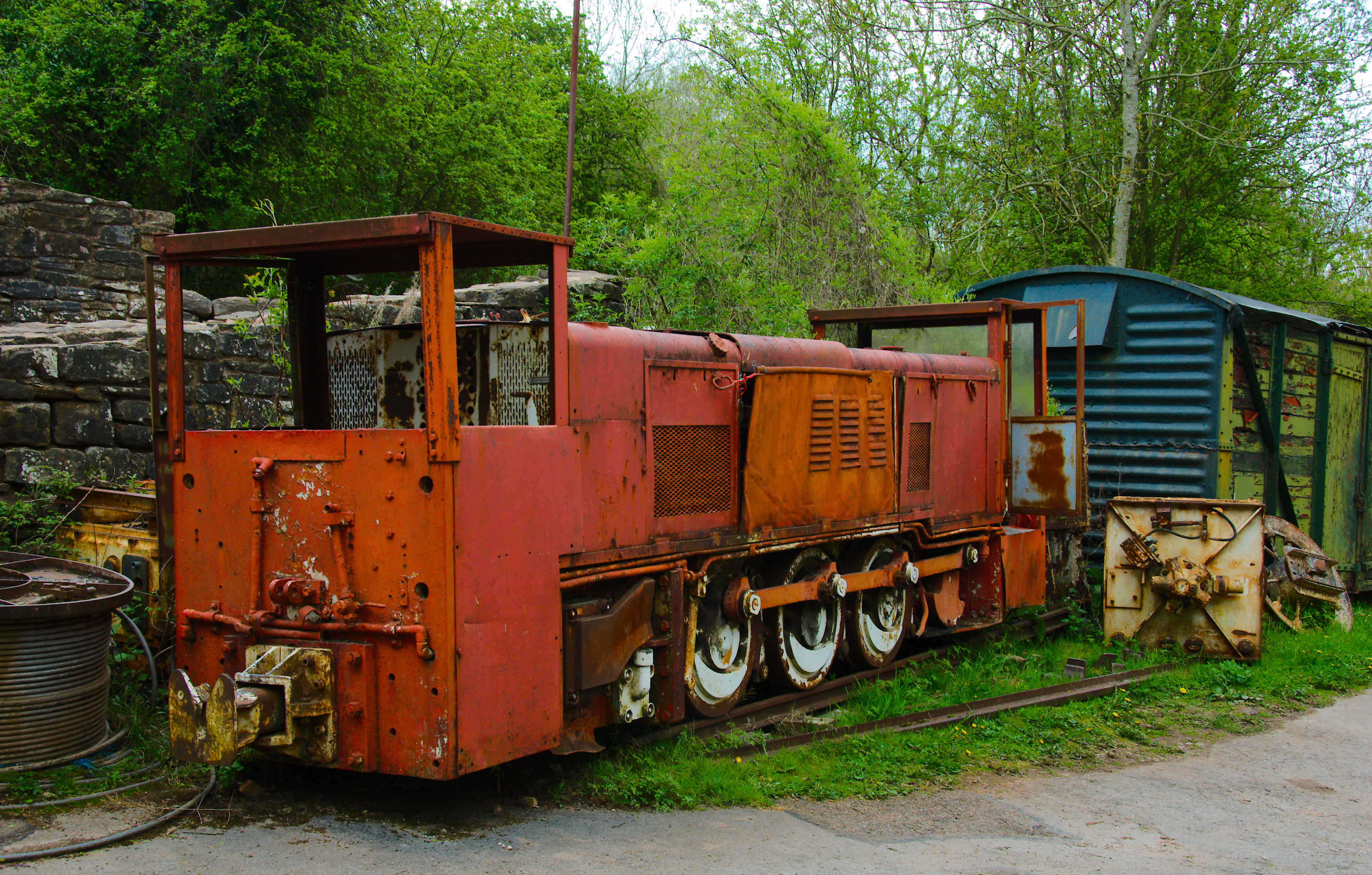 Two diesel-mechanical mining locomotives preserved at Clearwell Caves.