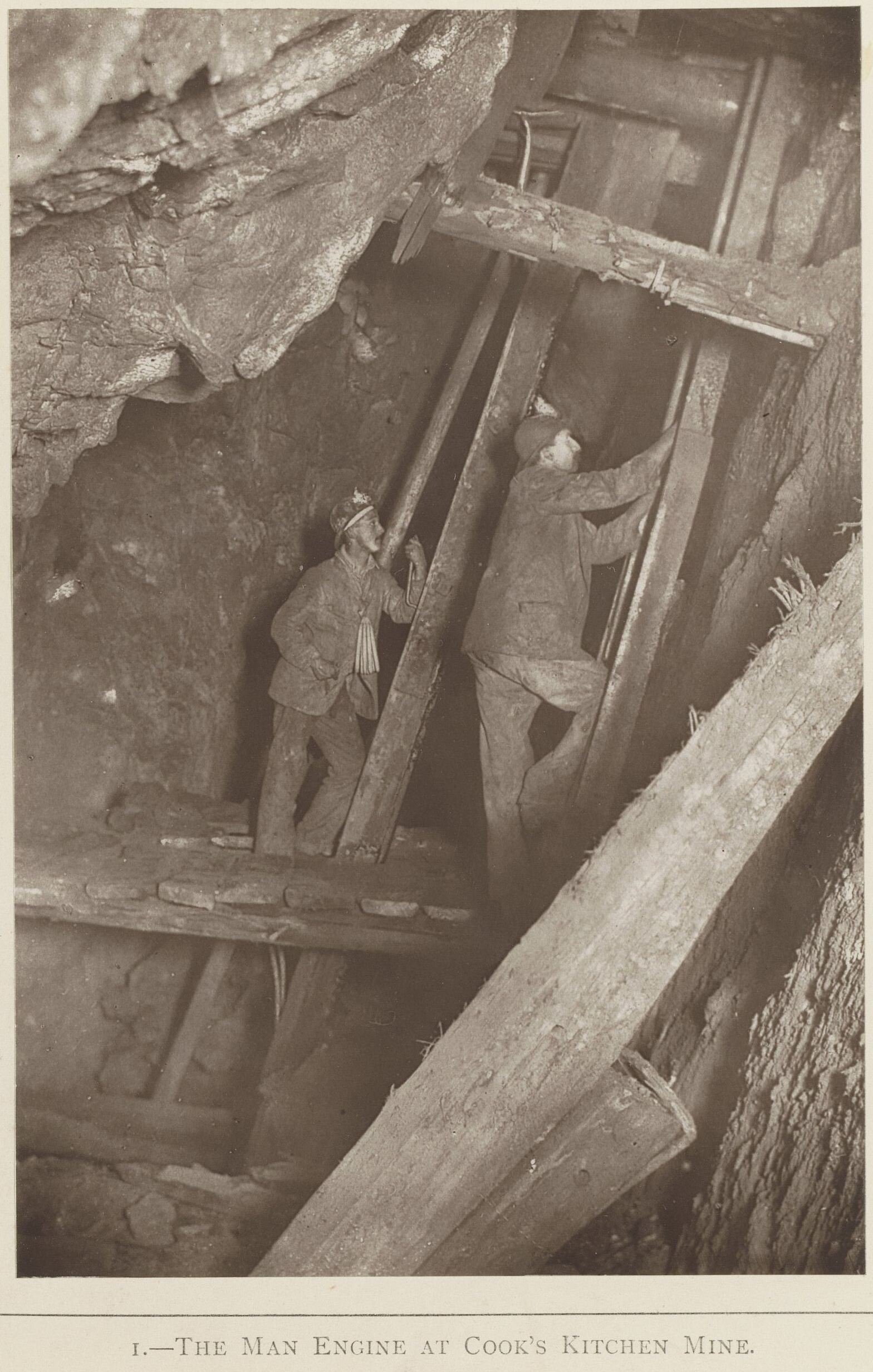 A historic photograph of miners operating the man engine at Cook's Kitchen Mine, Cornwall, c. 1893.