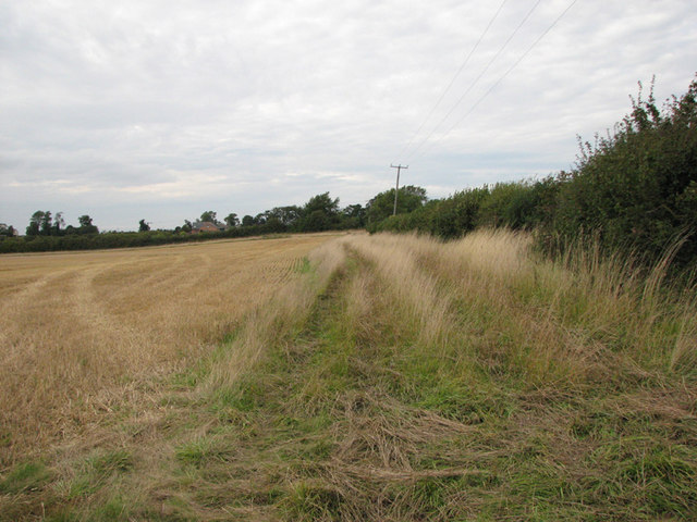 The site of former open ironstone quarries near Cottesmore, Rutland, now restored to agricultural fields with traces of the old quarry landscape still visible.