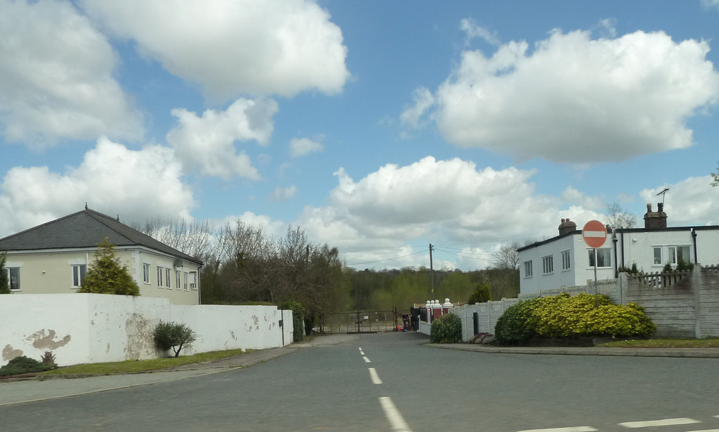Colour photograph of the entrance road and gates to the former Cronton Colliery site, taken in 2013 before redevelopment began.