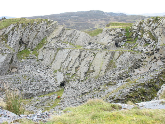 The abandoned quarry workings at Cwt-y-Bugail, showing the open pit and surrounding spoil.