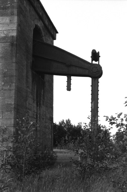 The surviving beam and pump rod of the Cornish pumping engine projecting from the bob-wall of the Devon Colliery engine house at New Sauchie.