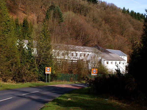 Surviving brick colliery buildings at the former Eastern United Colliery at Staple Edge in the Forest of Dean, standing among trees on the old pit-head site