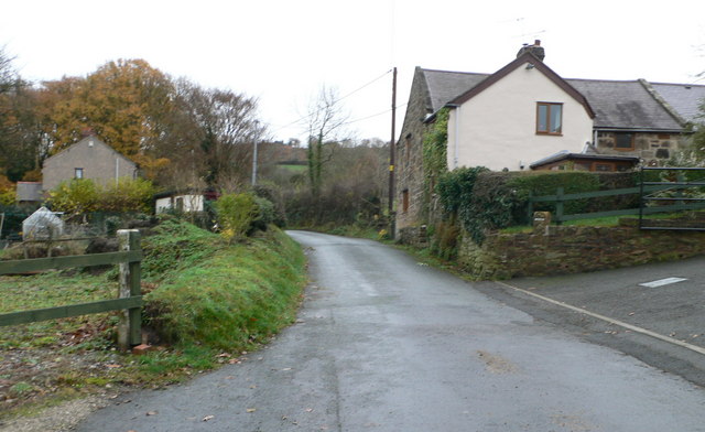 A narrow lane between hedged banks at Ffrwd, the wooded ground that once held the colliery, ironworks and brickworks