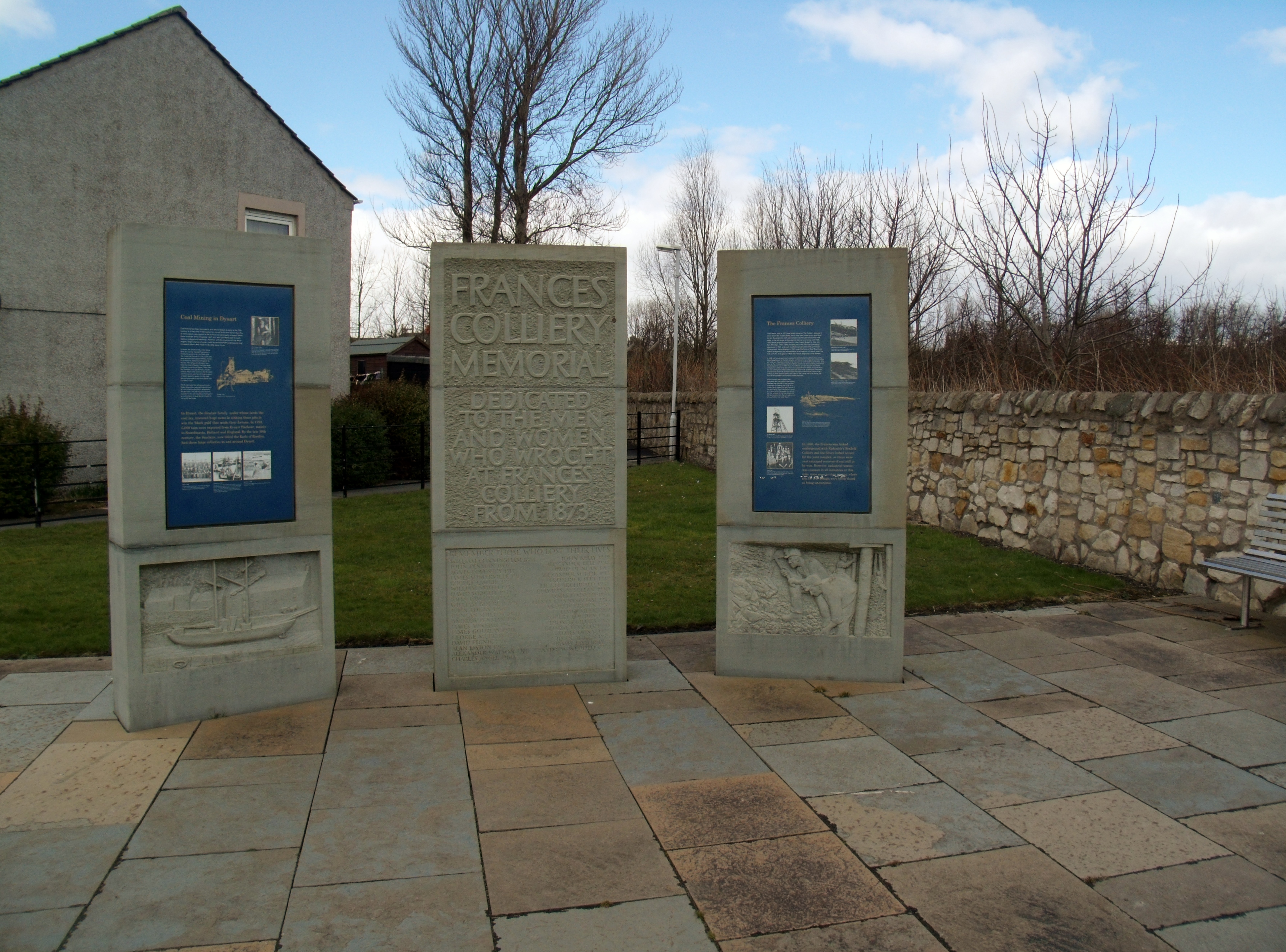 The preserved red-painted 1943 headframe of Frances Colliery, standing as a memorial above Dysart, Fife.