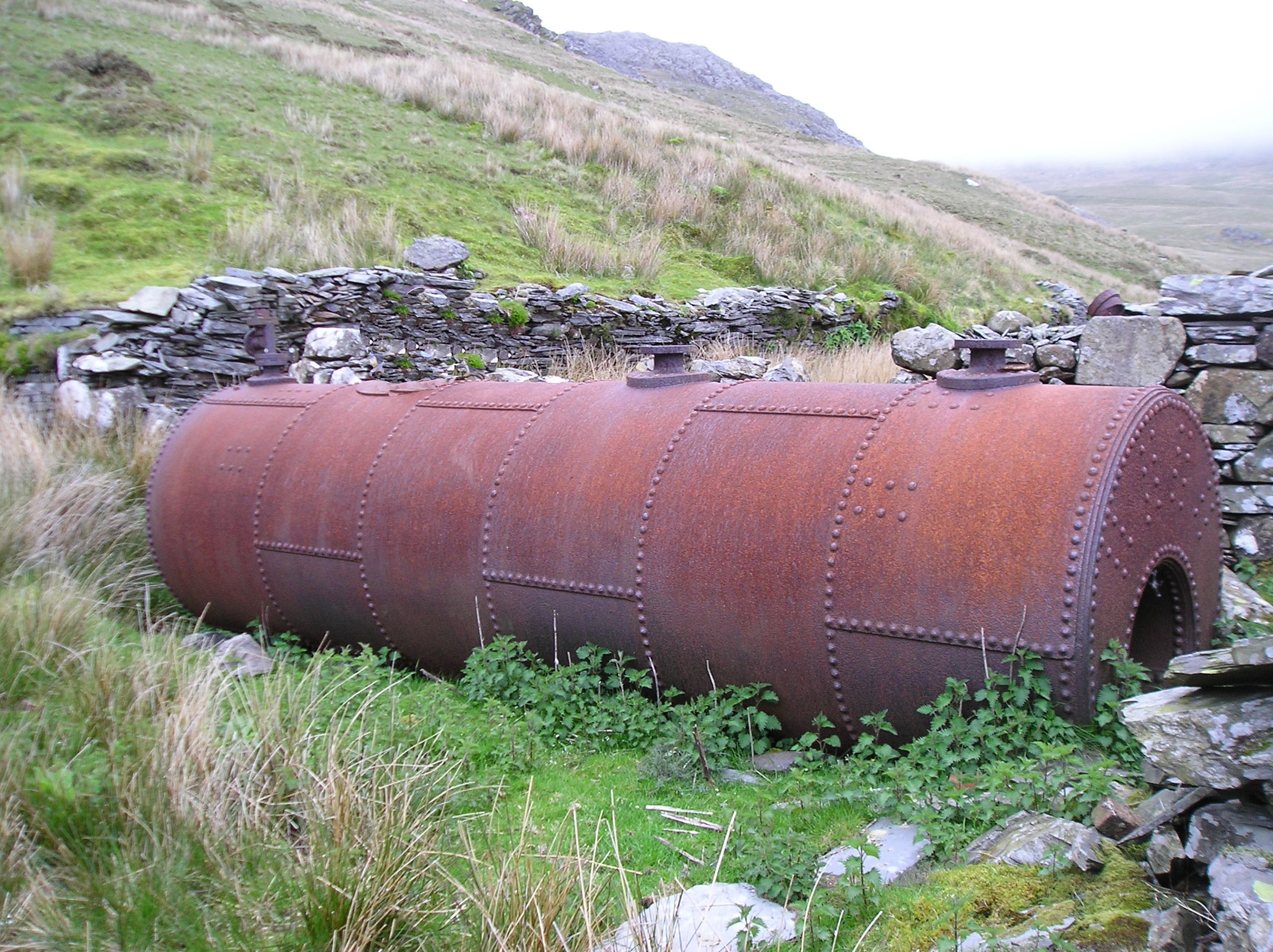 A surviving Lancashire boiler beside the mill ruins at Fron-Boeth Quarry.