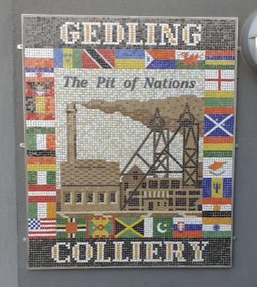 Photograph of a mosaic artwork at Gedling Country Park depicting the numerous nationalities of miners who worked at the former Gedling Colliery.
