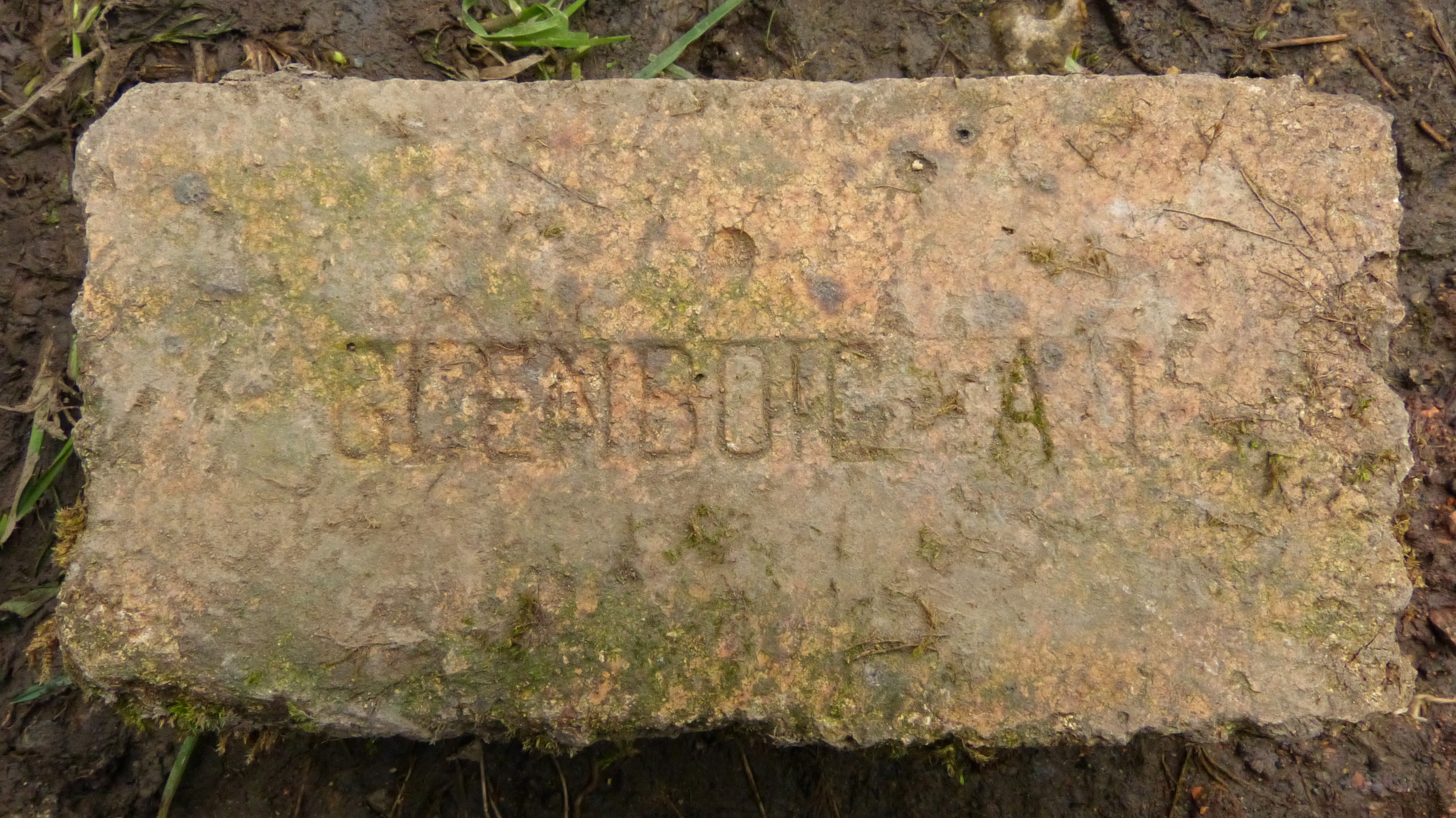 A firebrick stamped GLENBOIG — the product the fireclay mines existed to supply, found in furnace linings around the world.
