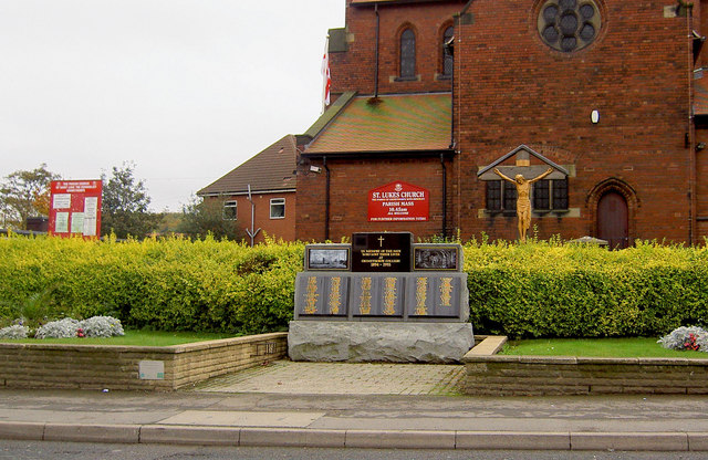 A stone memorial outside St Luke's church, Grimethorpe, commemorating people who lost their lives in the pursuit of coal at Grimethorpe Colliery