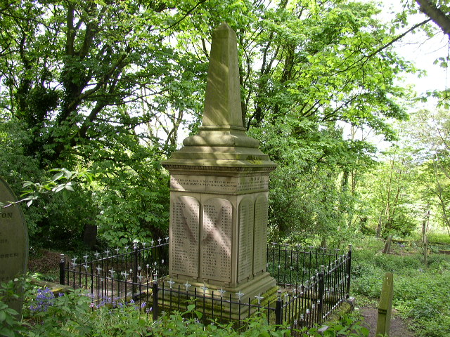 The Hartley disaster memorial obelisk on its sandstone pedestal in the churchyard of St Alban's, Earsdon, inscribed with the names of the 204 who died in 1862.