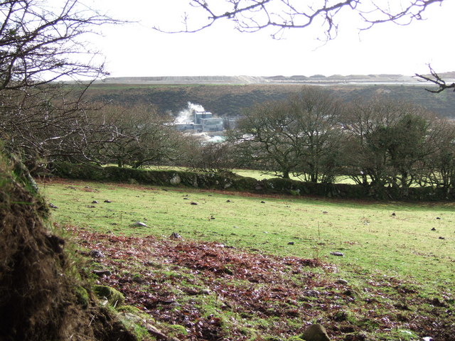 The buildings at the heart of Headon China Clay Works, seen across fields from a nearby footpath.