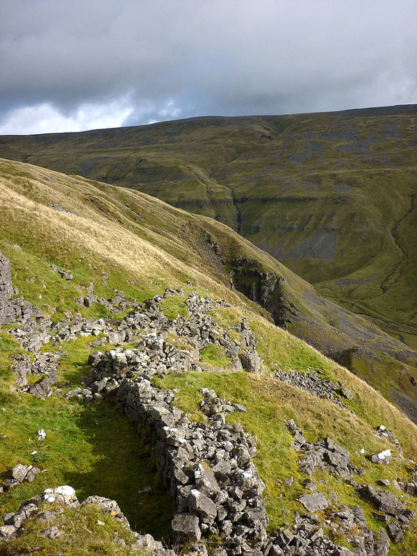 Ruined mine buildings on the steep valley side above Scordale, Cumbria.
