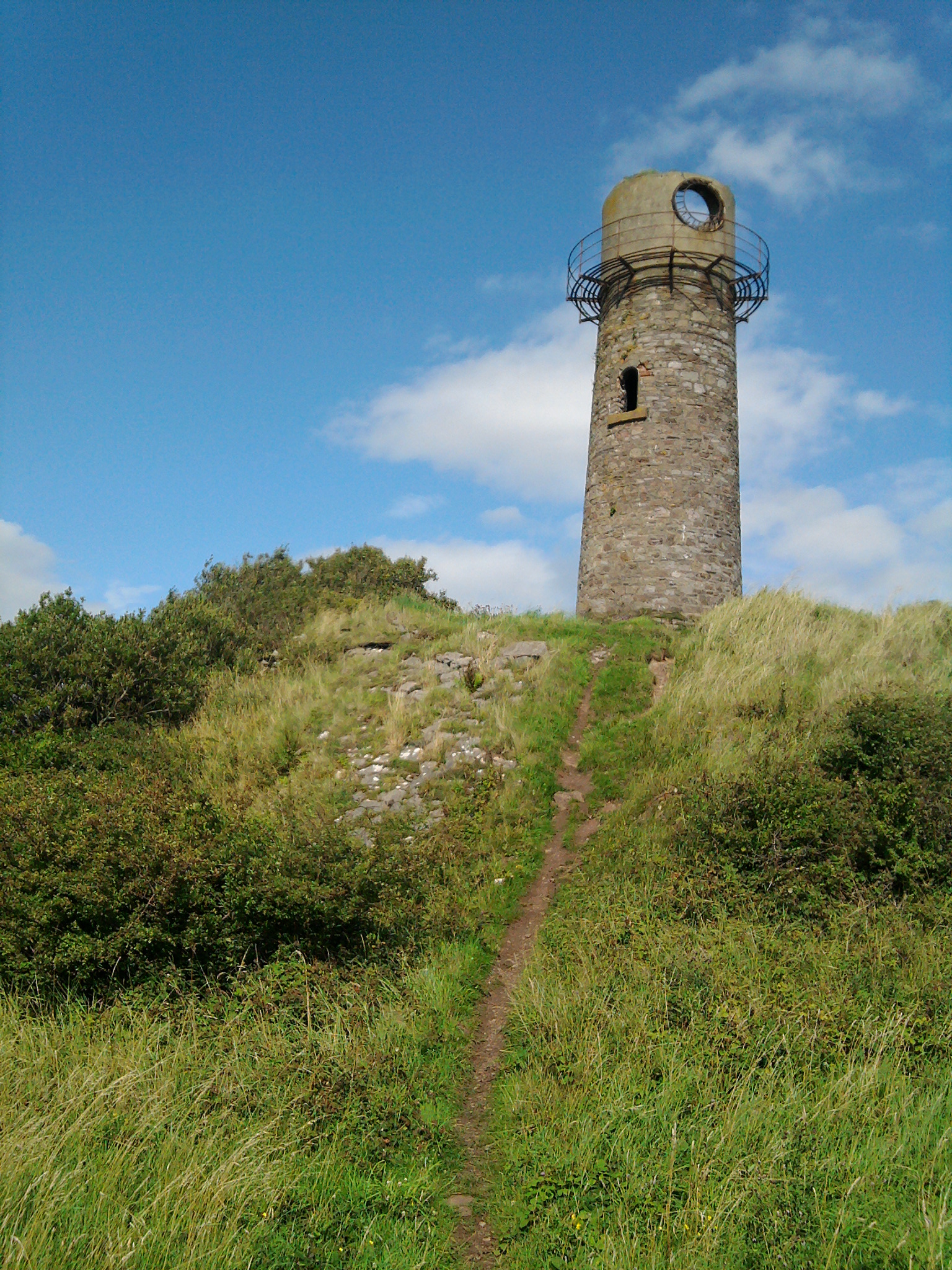 The disused 1866 lighthouse at Hodbarrow, Millom, one of the few structures still standing above the flooded former iron mine workings.