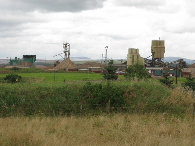 The working sand and gravel faces of Hyndford Quarry beside the River Clyde at Lanark.