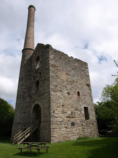 The ruined granite engine house at Hawke's Shaft, Killifreth Mine, with its tall chimney, the tallest surviving mine chimney in Cornwall.