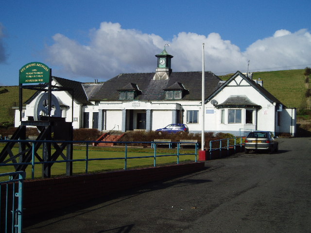 A single-storey stone building with a pitched roof and a small clock/bellcote feature, the Kinglassie Miners Welfare Institute, built 1931.