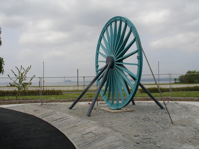 A colliery winding wheel from Kinneil, preserved and landscaped into an ornamental garden.