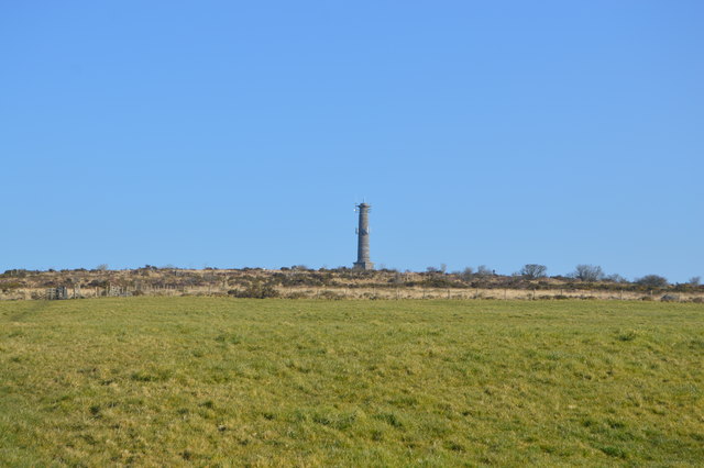 The tall granite and brick engine-house chimney standing at the summit of Kit Hill, Cornwall, built in 1858