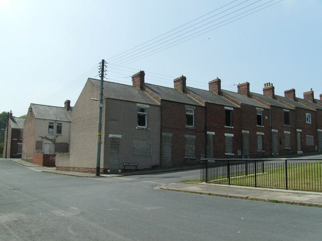 A terrace of brick colliery houses on Nelson Street at Ferryhill Station, built for Mainsforth Colliery's workers and photographed in 2007 when scheduled for demolition.