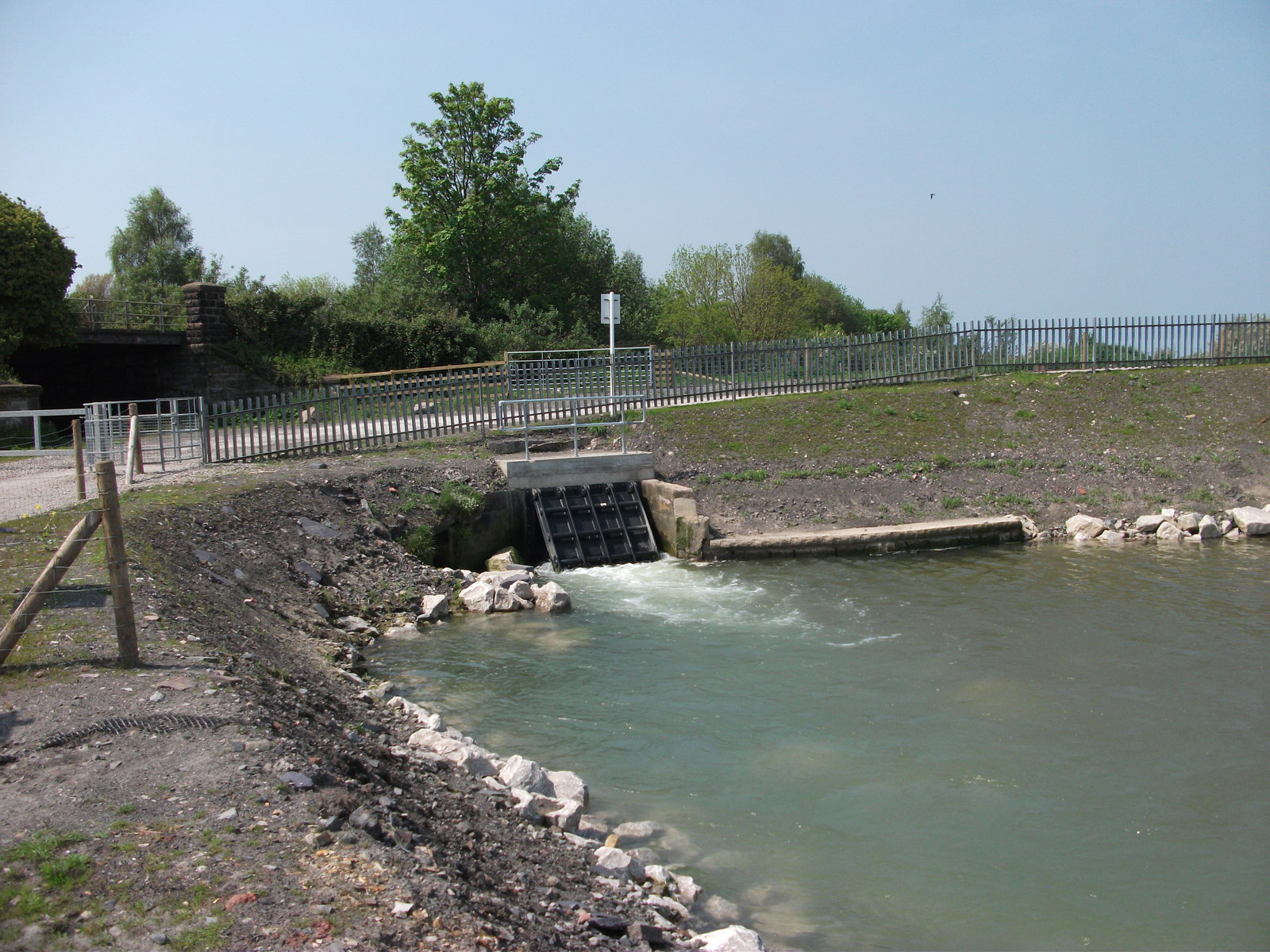 Modern flood-control sluice equipment on the Milwr Tunnel, still in active use for drainage.