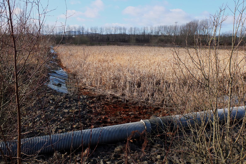 Dry settling ponds and a derelict building at the former Monktonhall Colliery site, photographed in 2012.