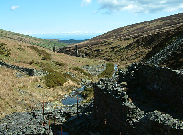 The open head of the Cornaa valley on the Isle of Man below North Barrule, rough hill grazing running down to the stream where the former mine workings lie