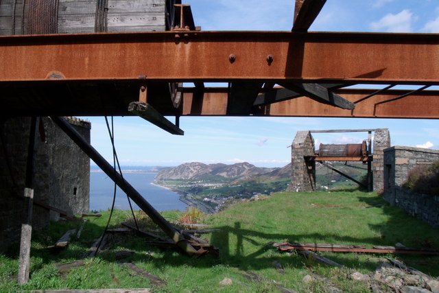 Benched granite quarry faces cut into the Penmaenmawr headland above the north Wales coast.