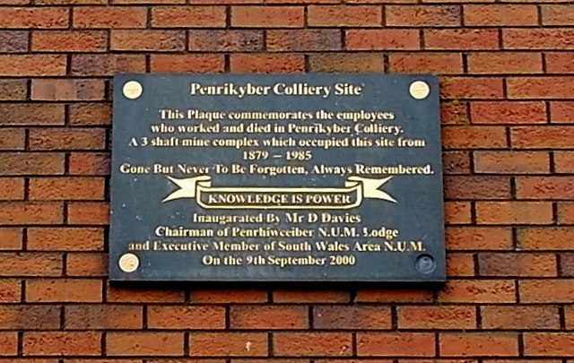 A commemorative plaque marking the site of Penrikyber Colliery at Penrhiwceiber, set on the ground now occupied by playing fields.