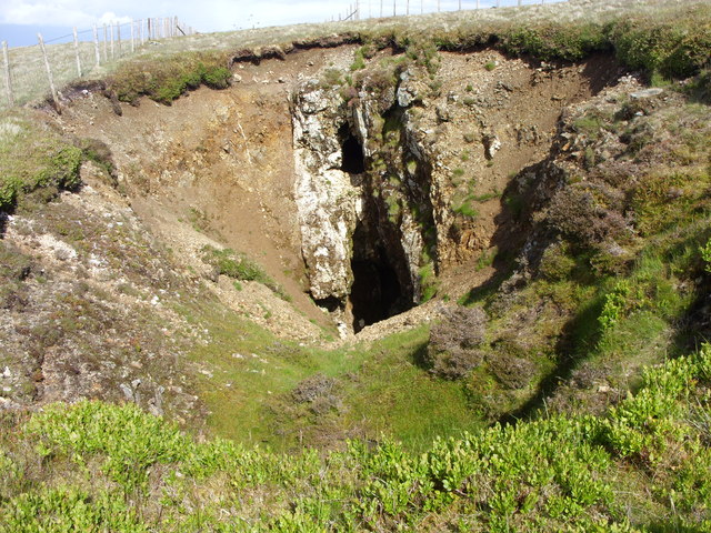 A vein exposed in the hillside at Potts Ghyll Mine in the Caldbeck Fells, pale mineral standing out against the darker broken rock around it