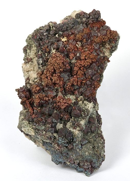 A mineral specimen from Ting Tang Mine showing hackly native copper with lustrous wine-red cuprite crystals on a quartz-rich matrix.