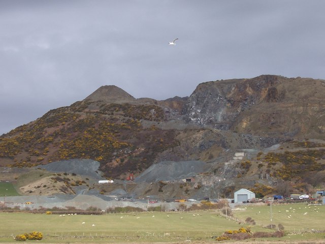 The disused granite workings at Tonfanau on the Gwynedd coast north of Tywyn, the bare rock faces rising above the coastal ground