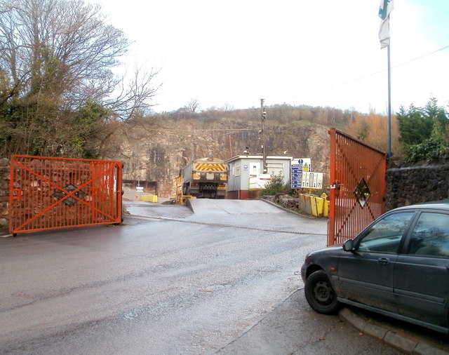 A view towards Wenvoe Quarry across a field, the workings largely hidden behind a belt of trees on the limestone ridge