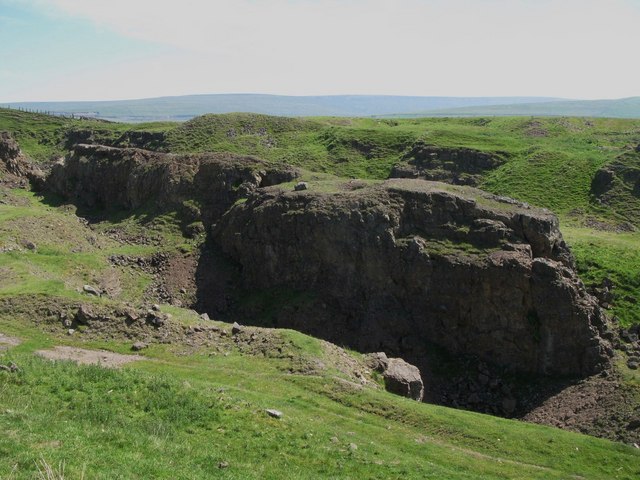The West Rigg opencast ironstone quarry, Weardale, with the Slitt Vein exposed as a rib along its centre.