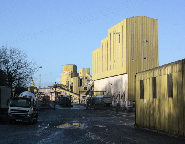The entrance road to Whatley limestone quarry near Frome in Somerset, the working area itself concealed behind screen banks and woodland
