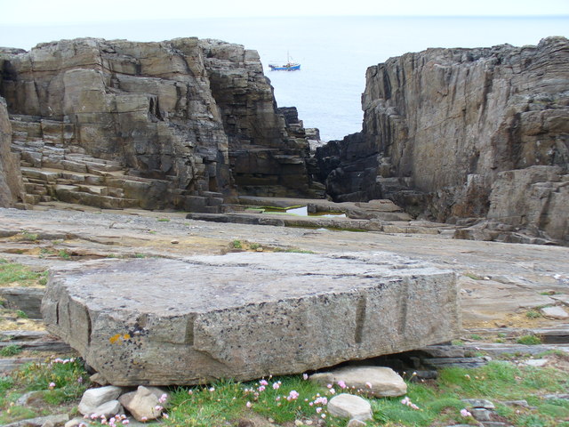The worked rock face of the Old Millstone Quarry on the clifftop at Yesnaby, Orkney.