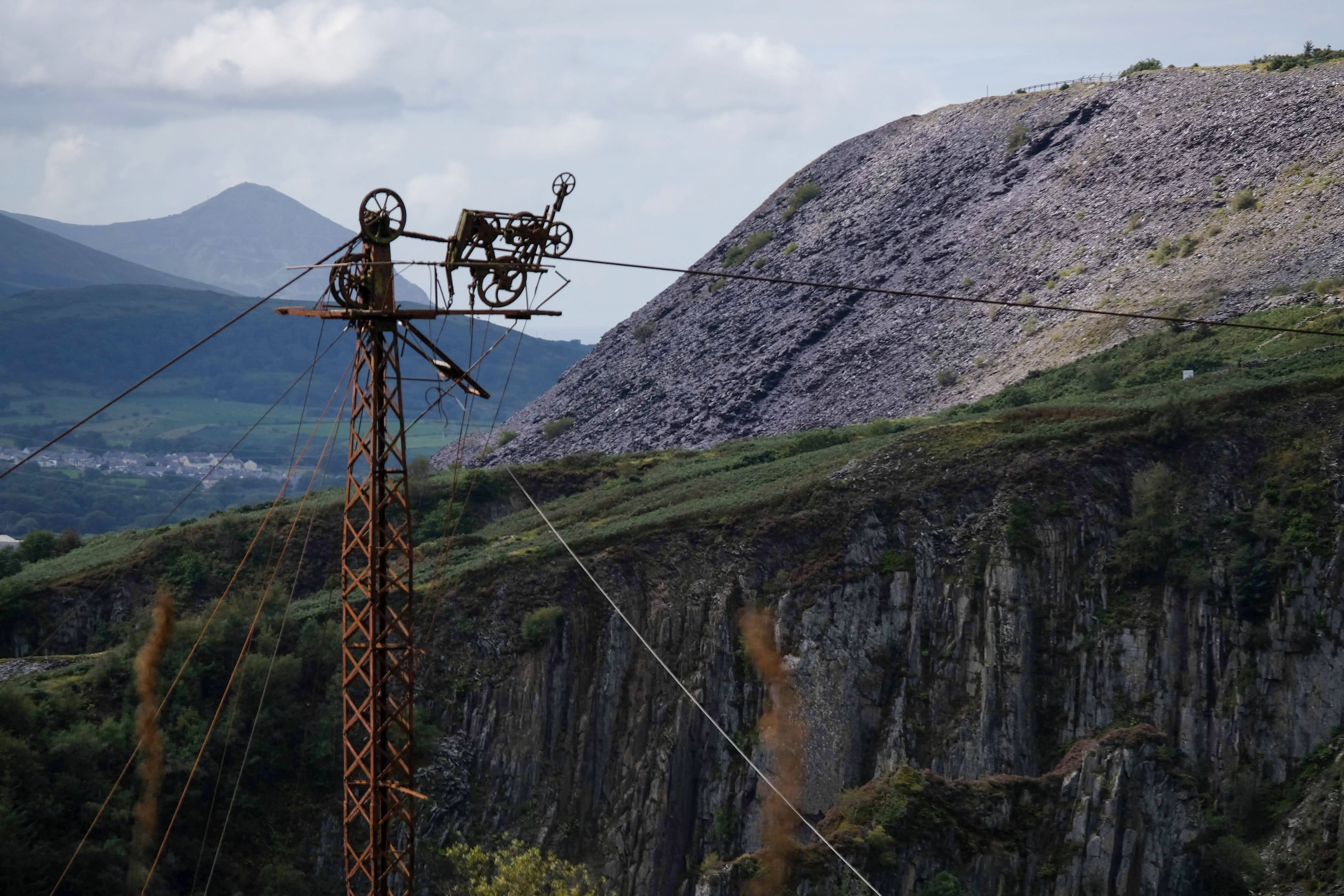The surviving Blondin carriage and cable at the abandoned Pen-yr-Orsedd slate quarry, with mountains beyond.