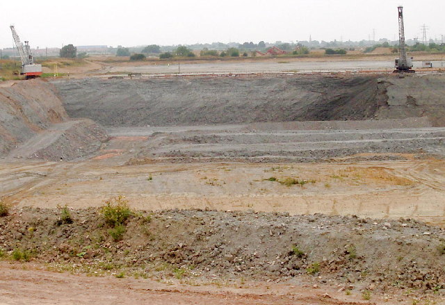A working clay pit at Bradley Fen near Whittlesey, cut into the Lower Oxford Clay — the carbonaceous bed that made the Fletton brick almost self-firing.