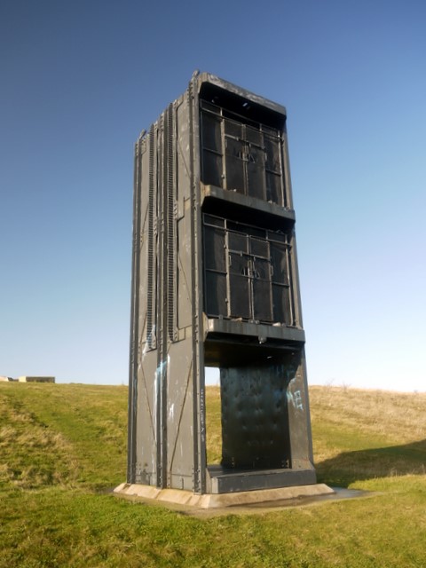 A preserved three-tier pit cage, now a monument at the former Easington Colliery, County Durham.
